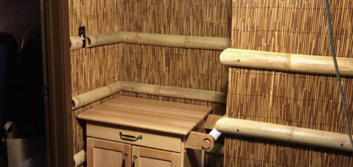 three rows of bamboo trim covering the brown walls in the entire space